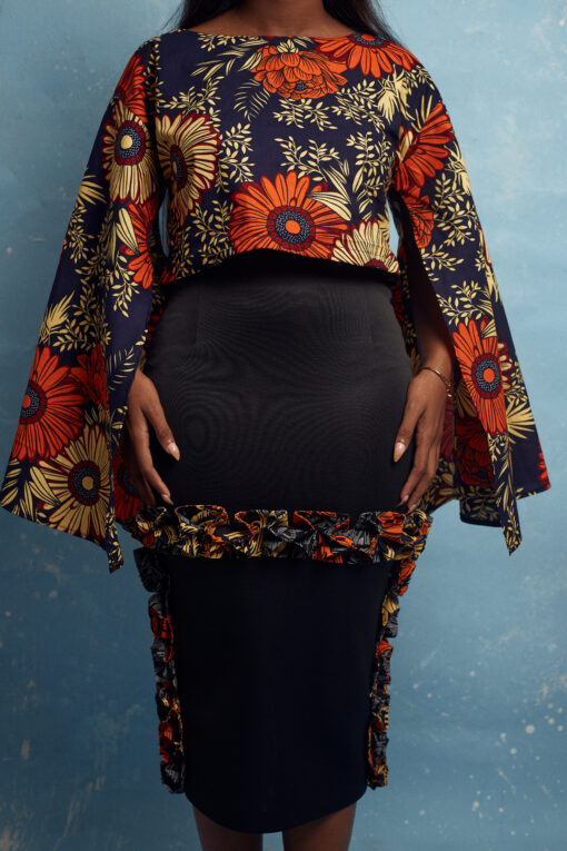 The NUTI Skirt is a midi pencil skirt with wax print ruffle detail made by MOD Ghana for It's Made To Order