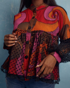 The ASEYE wax print blouse with tulle overlay smock and tulle balloon sleeves by MOD Ghana for It's Made To Order